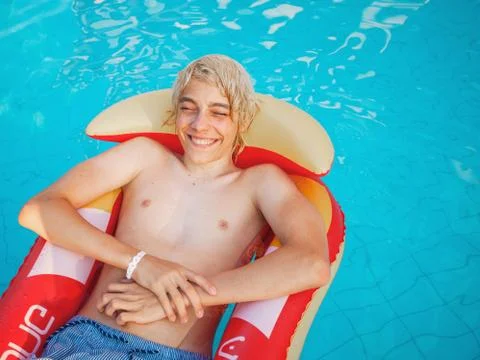 Handsome in the pool outdoor Stock Photos