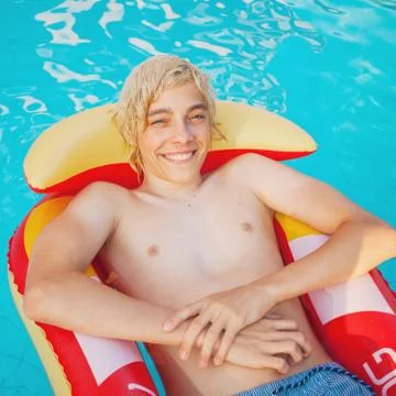 Handsome in the pool outdoor Stock Photos