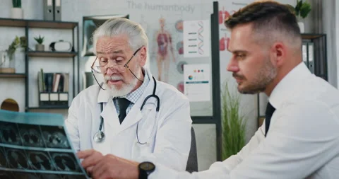 Handsome positive confident 40-aged bearded man visitingmedical office where Stock Footage 160836948