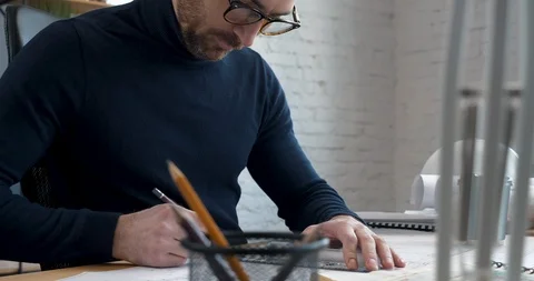 Handsome professional Architect working hard in Modern Loft Office. Attractive Vídeo Stock 126159923