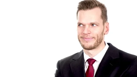 Handsome professional businessman pointing to empty copyspace on the left side Stock Footage 84010518