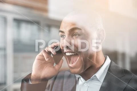 Handsome respectable guy screaming on cellphone Stock Photos