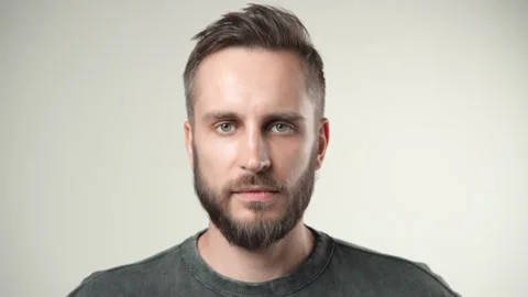 Handsome sad man looking at camera. Upset guy face portrait. Unhappy male person Stock Footage 252360226