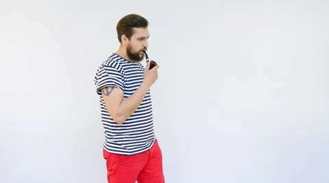 Handsome Seaman with a Beard Smoking a Pipe Stock Footage 66419475