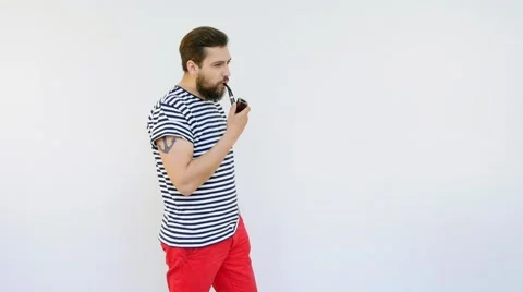 Handsome Seaman with a Beard Smoking a Pipe Stock Footage 66419682