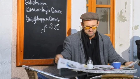 Handsome senior reading and looking about the newspaper Stock Footage 101607307