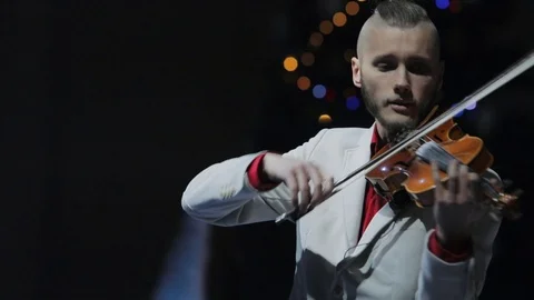 Handsome sensual violinist performs on stage slow motion Stock Footage 117626484
