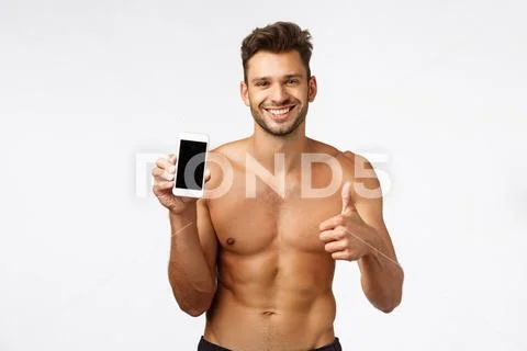 Handsome shirtless concept give good advice, suggest download workout fitness Stock Photos