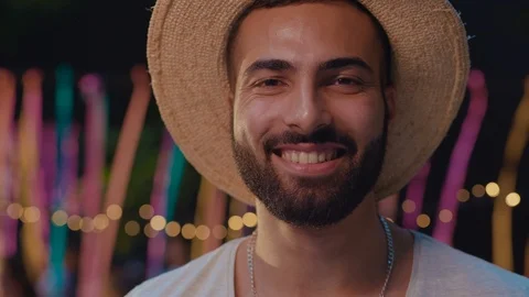 Handsome smiling man changing happy face into serious expression playing with Stock Footage 114929981