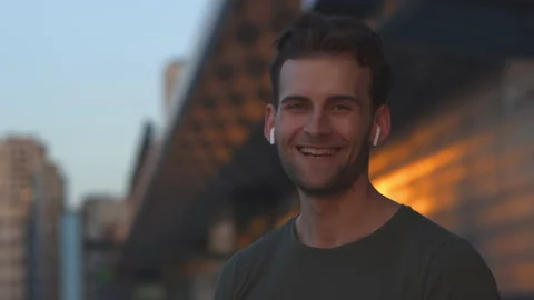 The handsome smiling man posing on camera. slow motion Stock Footage 140629708