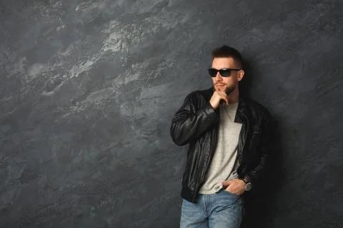 Handsome smiling man posing in studio Photos