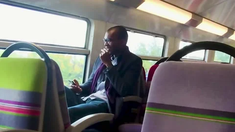 Handsome Smiling Young Black Man Talking on Mobile Phone, Sharing News. Stock Footage 228951338