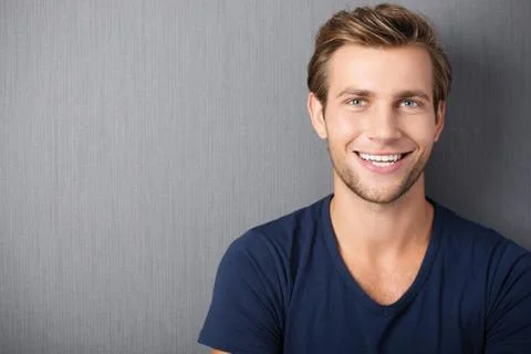 Handsome smiling young man Stock Photos