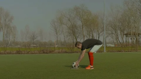 Handsome soccer player taking a penalty kick Stock Footage