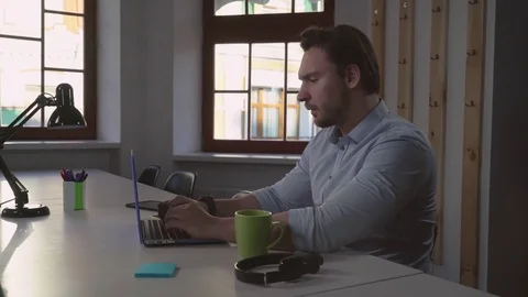 Handsome software developer work in office Stock Footage 73820977
