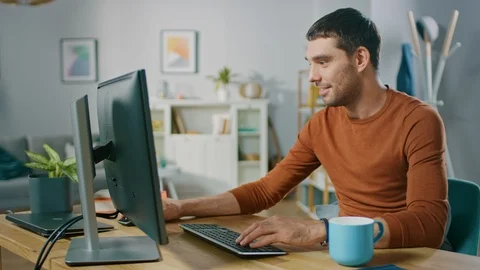 Handsome Software Engineer Works on a UX / UI Mobile App Template, Uses PC Stock Footage 98731959