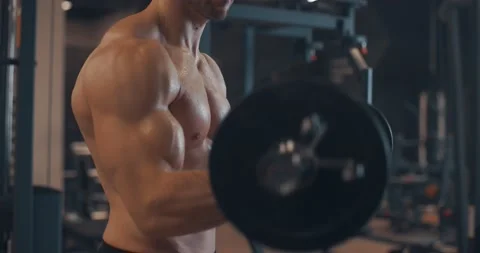 Handsome strong athletic caucasian men pumping up biceps muscles with bar in gym Stock-Footage 150763555
