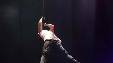 Handsome strong man pole dance. Stock Footage 275241778