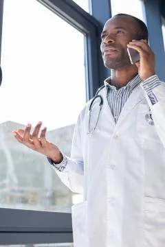 Handsome student having pause during studying Stock Photos