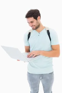 Handsome student using his laptop 写真素材