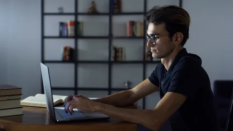 Handsome Student Working in the Library, Education Process, Studying Hard Stock Footage 93301376