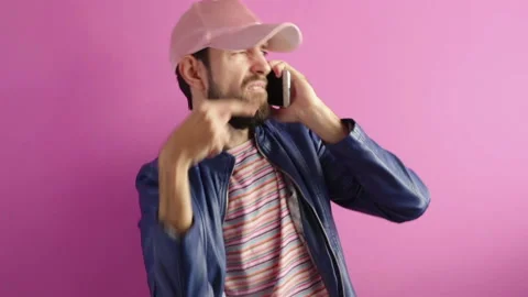 Handsome stylish bearded man  dancing and calling on smartphone Stock Footage 123063595