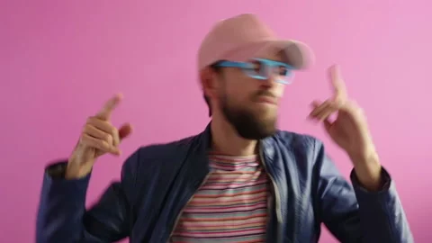 Handsome stylish bearded man fun  dancing  on pink background Stock Footage 121668882