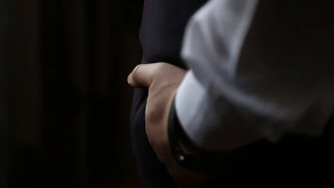 Handsome stylish man dressed in modern formal clothes buttoning jacket. Close up Vidéo 123783256