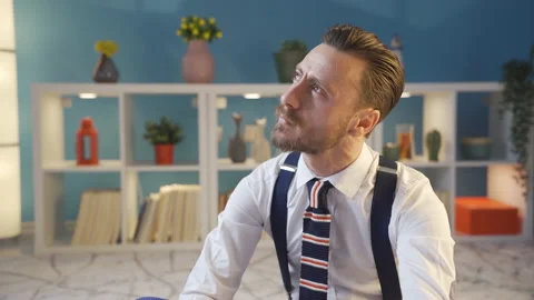 A handsome, stylishly dressed man imagining a plan in his mind. Stock Footage 230932819