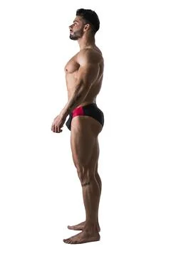Handsome topless muscular man standing Stock Photos