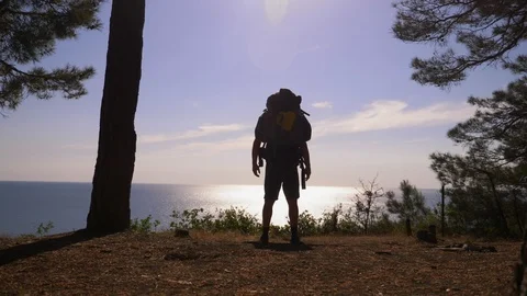 A handsome tourist man with a large backpack travels Stock Footage 90217784