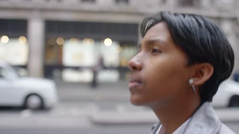 Handsome transgender man walking through the city, in slow motion Stock Footage 101057769