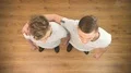 The handsome twin brothers gesture to the camera. View from above 4k or 4k+ Resolution