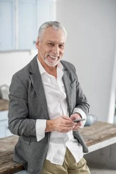 Handsome worker using his telephone Stock Photos