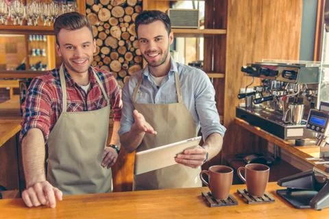 Handsome workers at cafe Stock Photos
