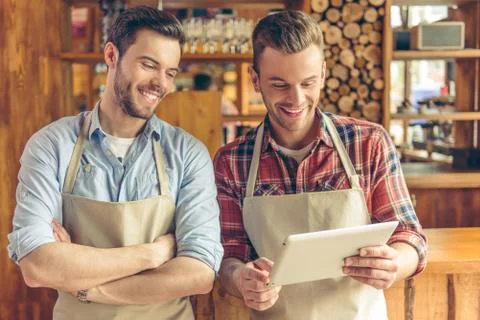 Handsome workers at cafe Stock Photos