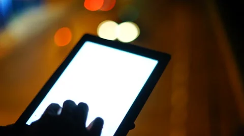 Handsome, young asain man with tablet computer in city at night Stock Footage 63563808