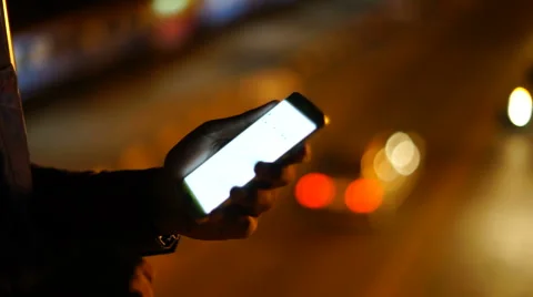 Handsome, young asain man with tablet computer in city at night Stock Footage 63571697
