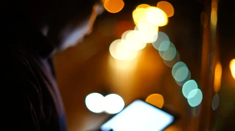 Handsome, young asain man with tablet computer in city at night Stock Footage 63572044