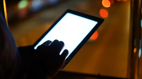Handsome, young asain man with tablet computer in city at night Stock Footage 63572708