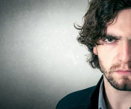 Handsome young bearded man Stock Photos