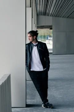 Handsome young bearded man posing outside Stock Photos