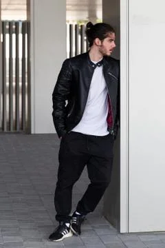 Handsome young bearded man posing outside Stock Photos