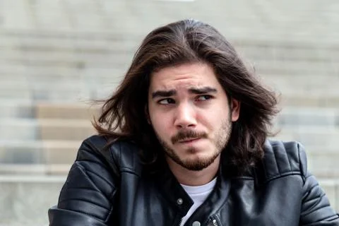Handsome young bearded man posing outside on copy space Stock Photos