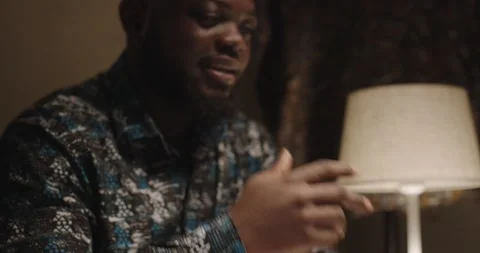 Handsome Young Black African Man Having Online Conversation on a Laptop Computer Stock Footage 345604473