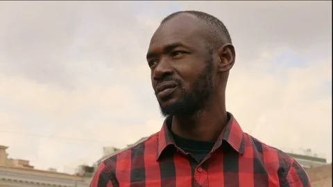 Handsome young black man looking around- outdoor Video stock 87400980