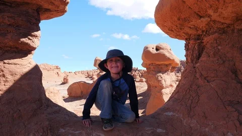 Handsome young boy smiling at Goblin Valley Utah 스톡 동영상 118491024