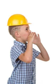 Handsome young builder in blue checkered shirt and building helmet screaming Stock Photos