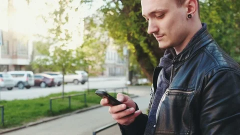 Handsome young business man using smartphone smiling happy outdoors. Stock-Footage 75895003