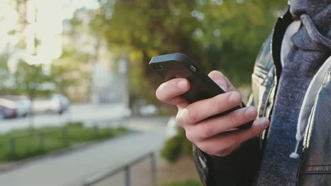 Handsome young business man using smartphone smiling happy outdoors. Video stock 75896507